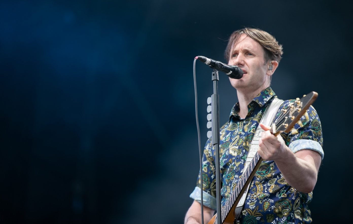 Tim Wheeler performing live on stage.